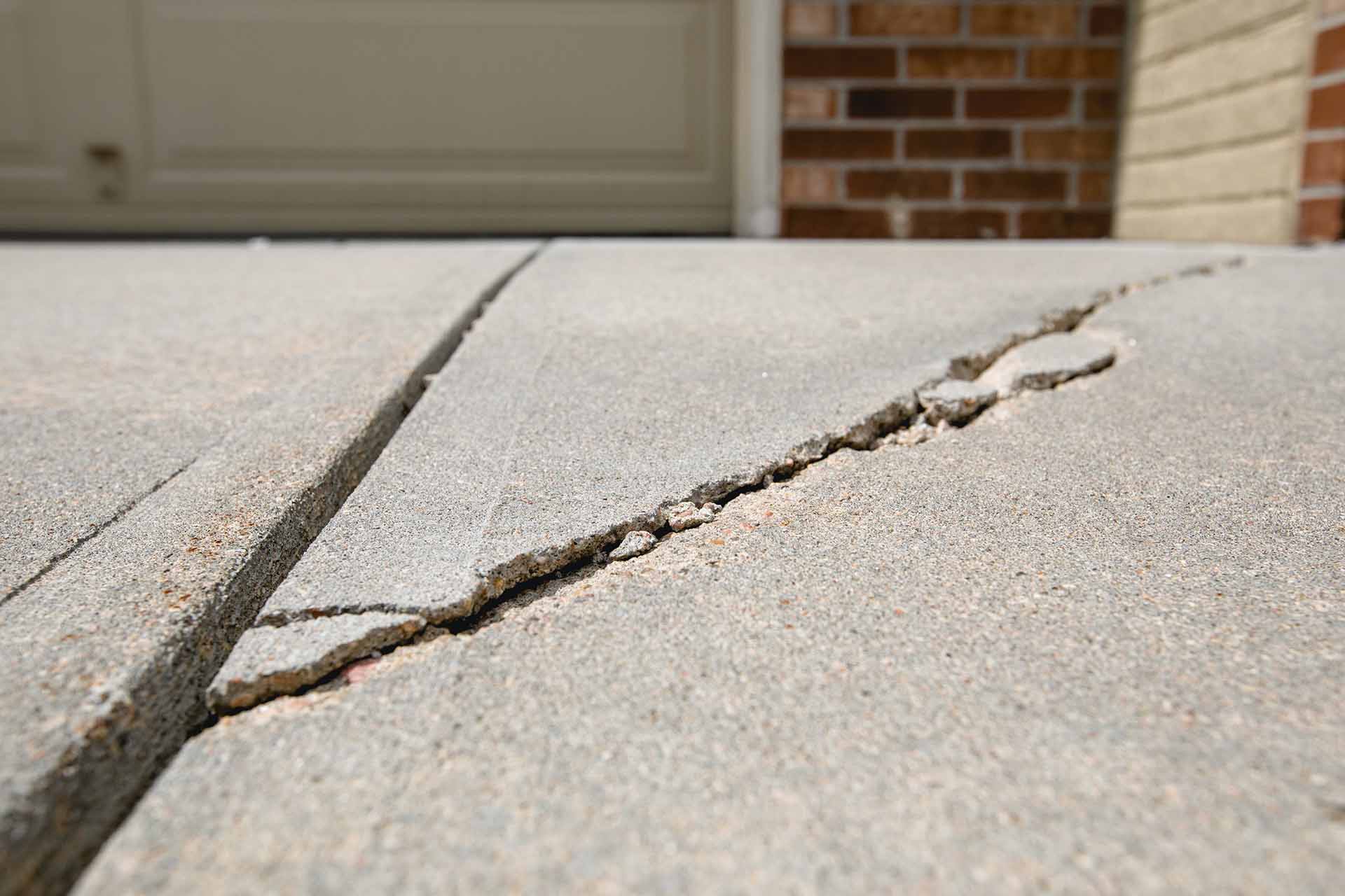cracked and uneven driveway
