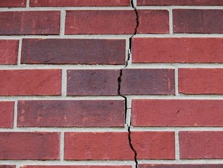 vertical crack in red brick